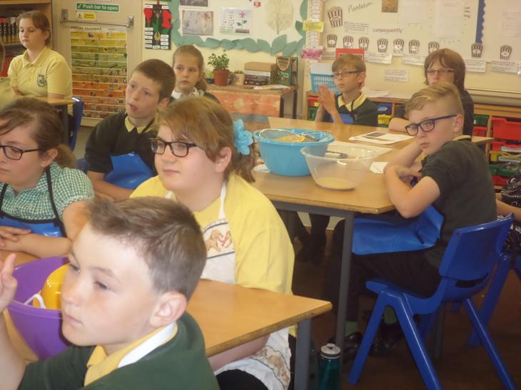 Pine Class listening intently to the instructions from the chef online.